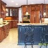 Stained maple kitchen with granite counter tops, island and high bar are a sanded charcoal black.